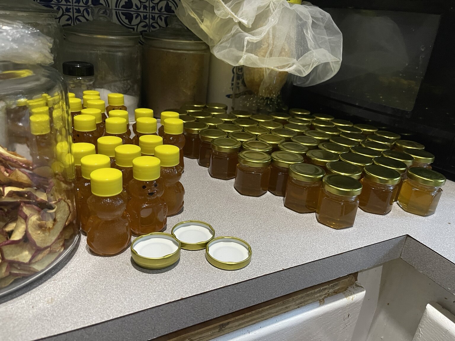 Rows of homestead honey prepared for local customers